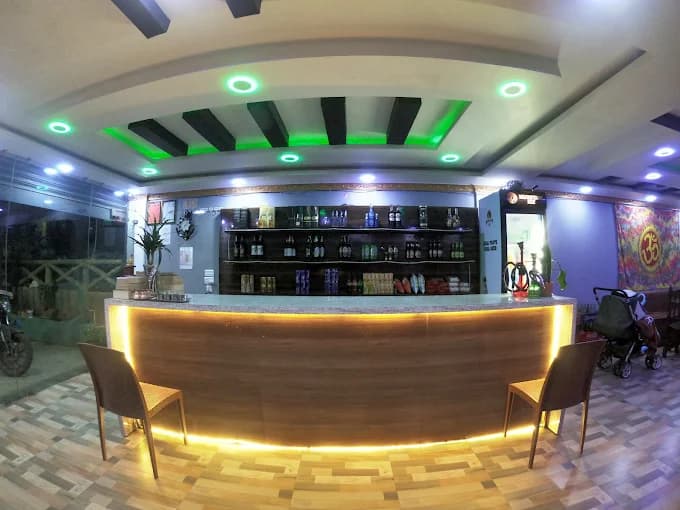 Bar with blue LED lighting at Paul's Hotel Bhedetar